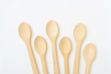 Wooden spoon on a white background. Wooden dishes. Isolate on a white background.