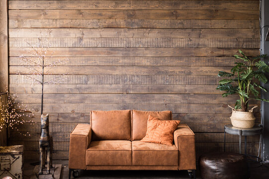 living room interior with leather sofa brown wood plank wall