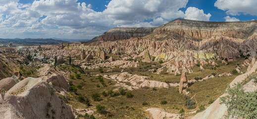 View of rock formations Fairy Chimneys of the Rose valley in Cappadocia, Turkey
