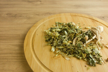 Calming herbal tea mix from medicinal herbs on rustic table