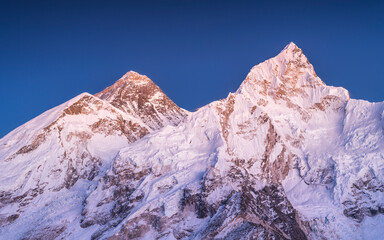 view to peaks Nuptse and Everest under blue sky after sunset in Nepal
