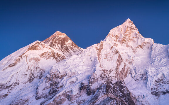 view to peaks Nuptse and Everest under blue sky after sunset in Nepal
