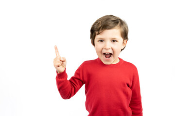 Portrait of cheerful boy pointing to the right - isolated over white background.