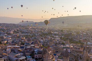 Hot air balloons above Goreme town in Cappadocia, Turkey