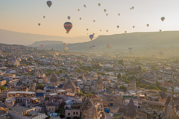 Hot air balloons above Goreme town in Cappadocia, Turkey