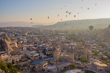 Hot air balloons above Goreme village in Cappadocia, Turkey