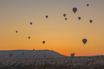 Hot air balloons above Cappadocia landscape, Turkey