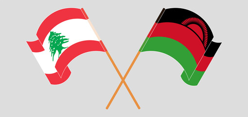 Crossed and waving flags of the Lebanon and Malawi