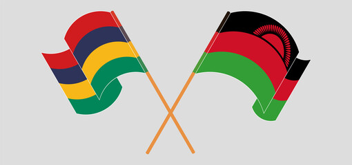 Crossed and waving flags of Mauritius and Malawi