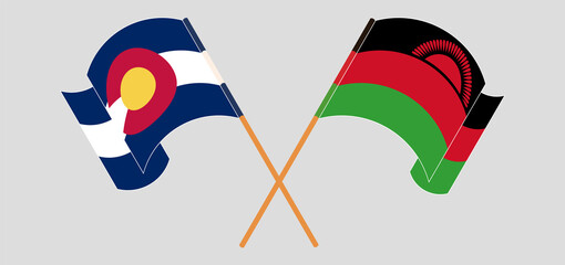 Crossed and waving flags of The State of Colorado and Malawi