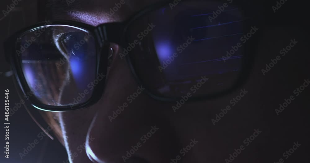 Leinwandbilder 4K Video Close up macro asian eye with eyeglass with coding reflection. Concept for coding and programming.
