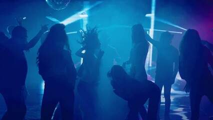 Full dancing floor in club, young people enjoying evening party. Nightlife, modern music and entertainment concept.