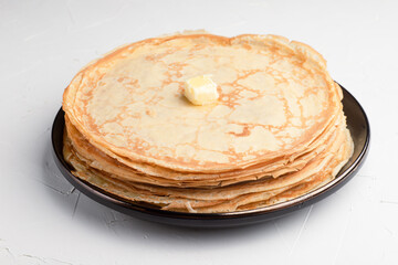 A stack of delicious pancakes on a white background, Russian cuisine.