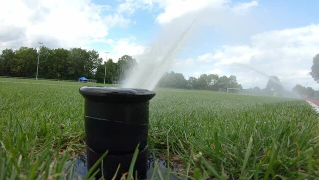 irrigation with the help of pressure jets with water at the football stadium