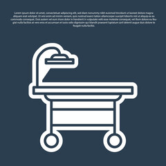 Blue line Operating table icon isolated on blue background. Vector Illustration