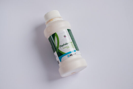 Tallinn, Estonia - 02.08.2022: Duphalac Fruit solution bottle contains laxative called lactulose by Abbott Biologicals B.V. Medical treatment and pharmacy concept.