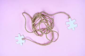 the connection with a string between two pieces of puzzle