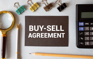text Buy-Sell Agreement on white paper. concept business