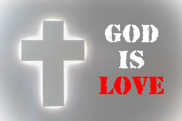 Fototapeta premium God is love - christian lettering, biblical phrase on blue and yellow with lights background.
