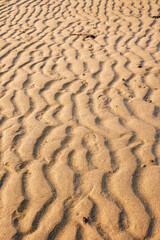 Warm sand texture on a beach, Abstract design background.