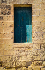 An old elevated door in the city of Mdina in Malta