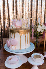 Sweet 16 gold and pink drip cake