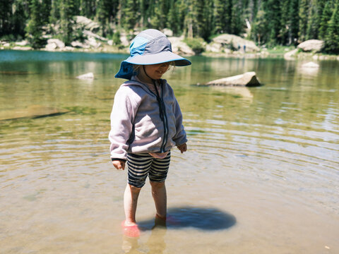 Girl standing in the shallow water of Brady Lake, Colorado