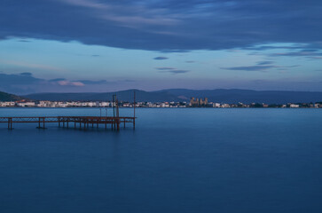 Fototapeta na wymiar long exposure, pier at sunset and candarli castle