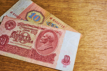 Vintage soviet banknotes on a wooden table