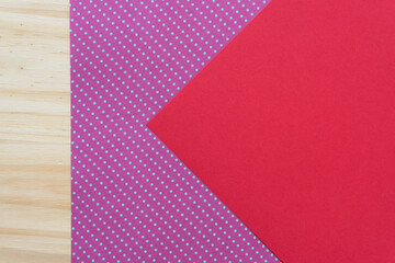 background with red paper, polka dots, and wood