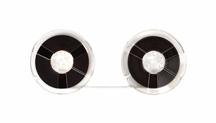 Vintage open reel audio tapes moving from one reel to another. Isolated on white. 