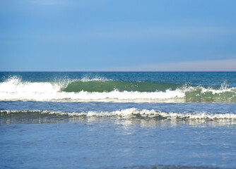 Waves at sea. Waves at sea during storm and wind. Wave from the sea goes on land to the beach....