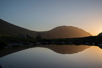 Sunset reflection in the puddle