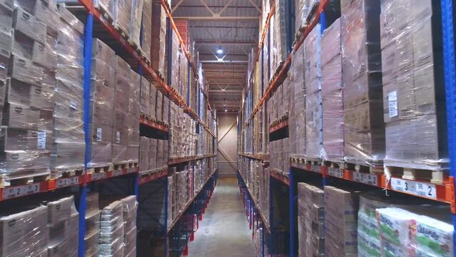 Industrial interior in a warehouse with boxes. Flight in a large modern warehouse.