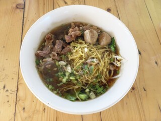 close up blood noodle food on wooden table