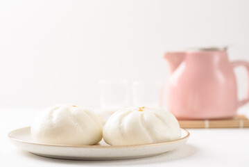 Steamed Chinese bun on white background, a popular Asian street food