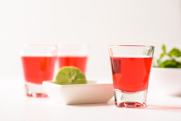 Red tequila with lime and mint on white background, Tropical spring and summer vacation concept