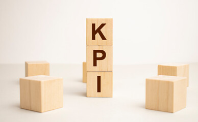 KPI, key performance indicator symbol. Concept word KPI, key performance indicator on wooden cubes on beautiful white background, copy space.