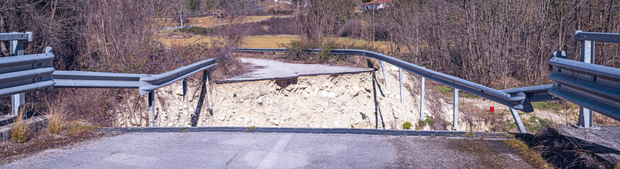 collapsed road bridge due to an overflow of the Mollarino stream tributary of the Melfa river,in Picinisco amid the Italian Apennine mountains of the south-east Lazio region,wide shot