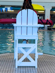 Lifeguard Chair sits by the pool.