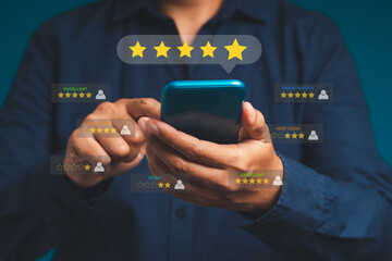 Customer service and satisfaction surveys concept. Man using a smartphone give the five-star icon a...