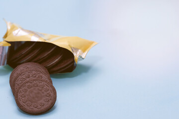 cookie in package isolated on blue background