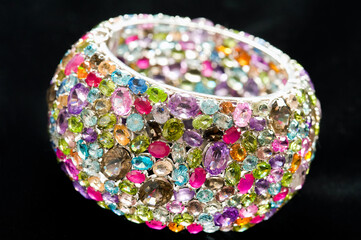 close up shot, bracelet with gems on black background