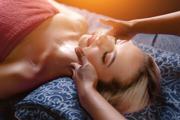 Obraz na płótnie Canvas a woman on a massage in the spa. Beauty and health center
