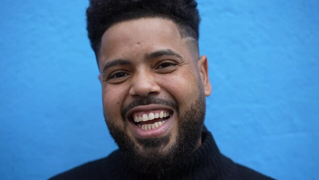 A smiling young black man portrait face