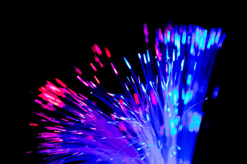 Close up of blurred light fiber optics for communication technology network