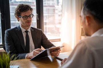 Executive or manager interviewing applicants. Talk about past work experience and competence in the...