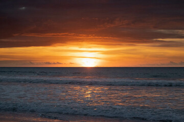 Fototapeta na wymiar Sunset on ecuadorian beach at golden hour