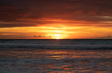 Fototapeta na wymiar Sunset on ecuadorian beach at golden hour