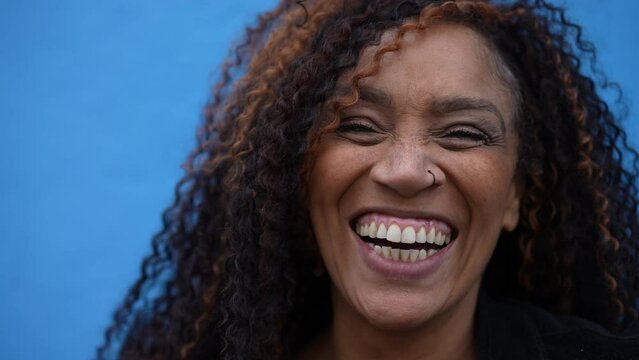 Portrait of a smiling Brazilian latin woman closeup face in 40s